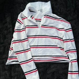 White cropped polo with blacks and red strips